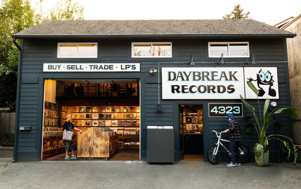 Exterior of Daybreak Records in Fremont, with a garage door open showing many records