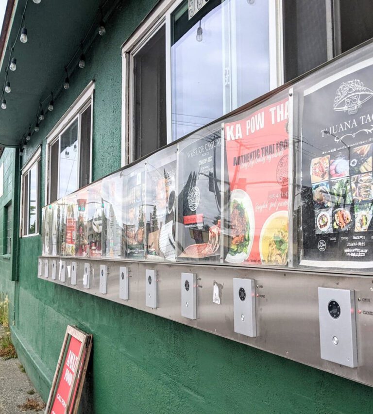 A wall featuring many different take-out windows.