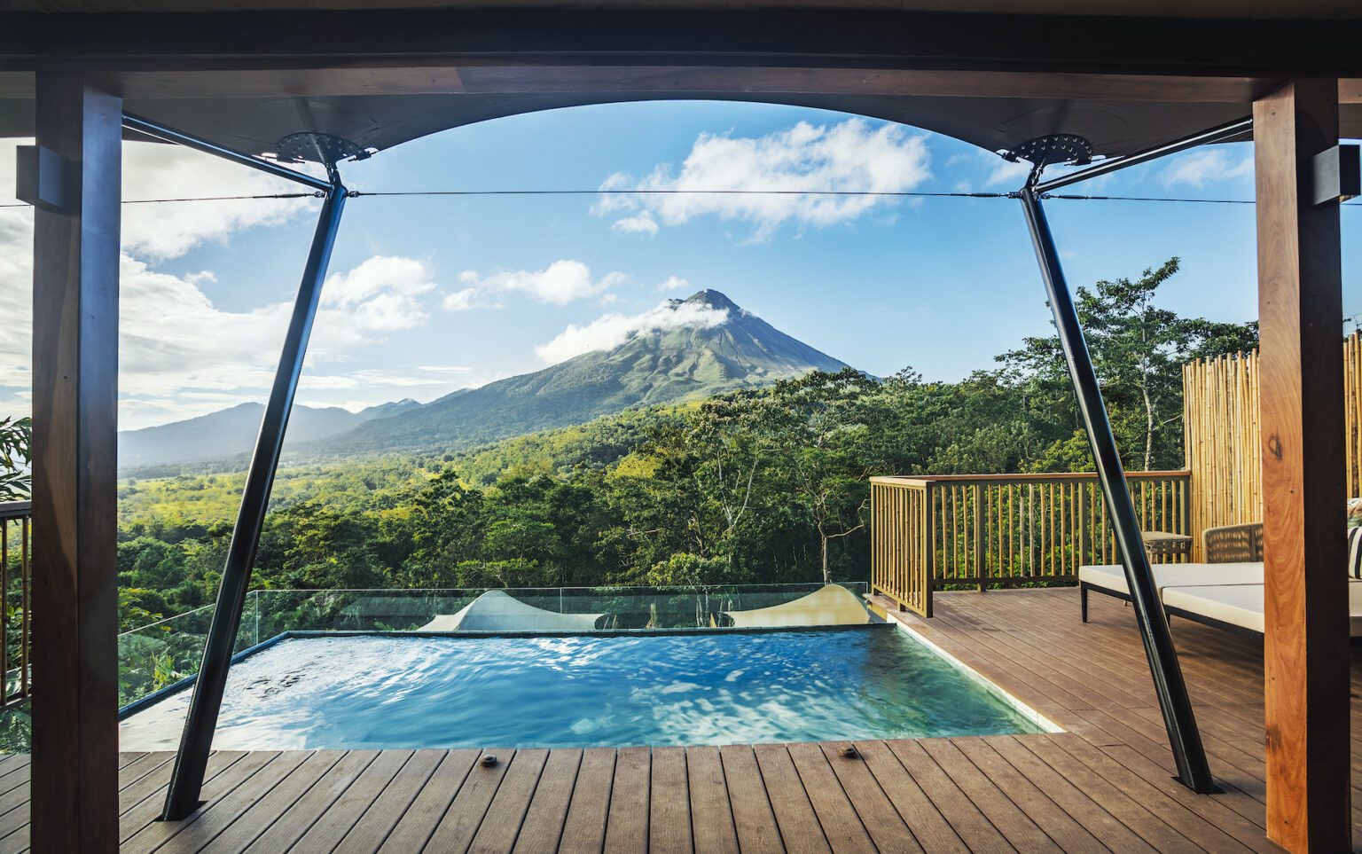 pool at tented camp in Costa Rica in front of mountain