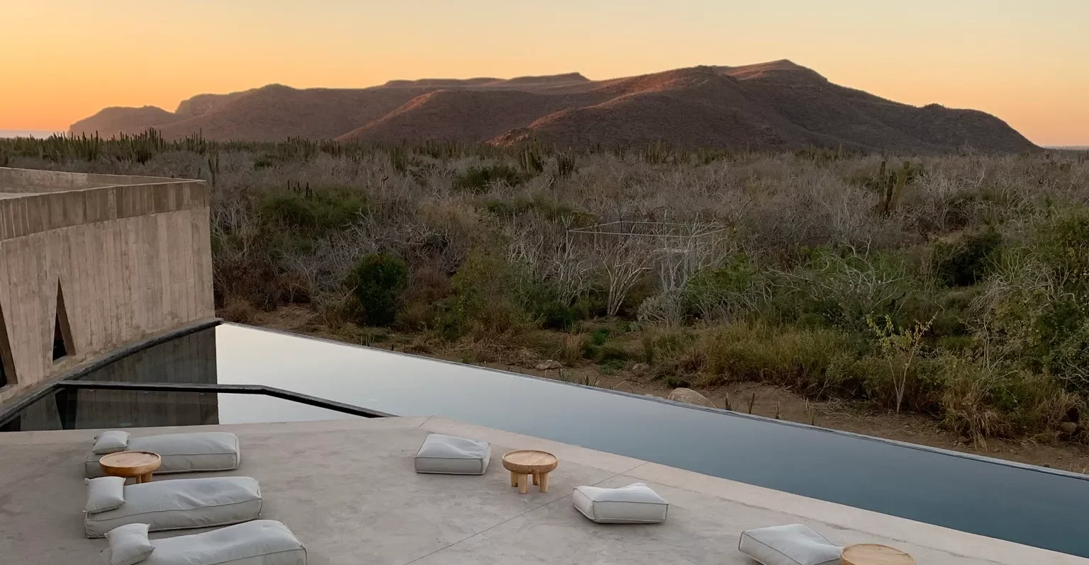sunset over pool at hotel in todos Santos Mexico