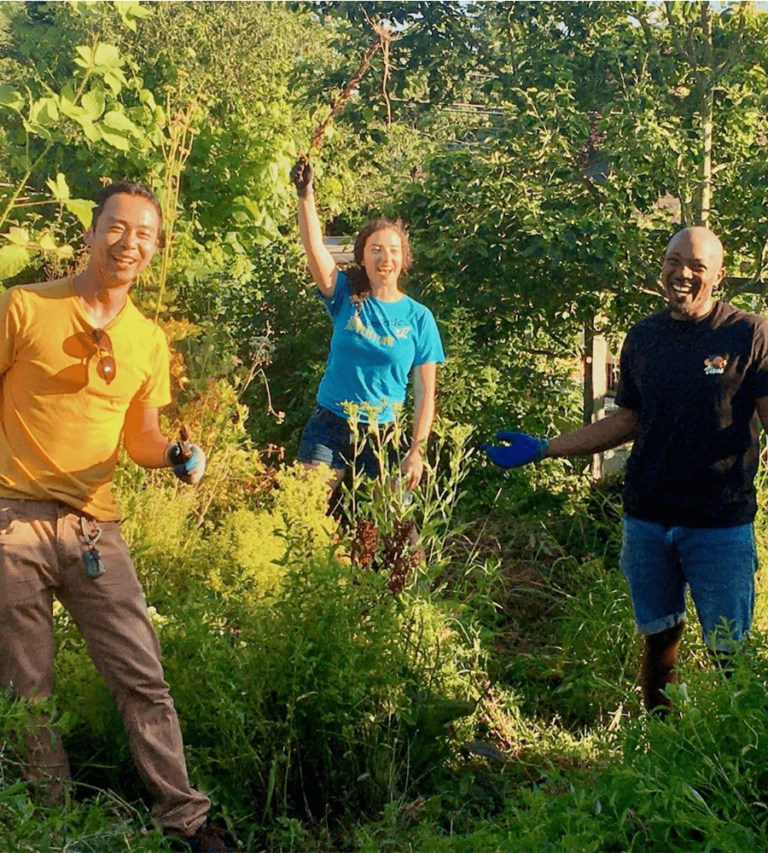 BeaconHilFoodForest Volunteers at the Beacon Hill Food Forest smile and thumbs up