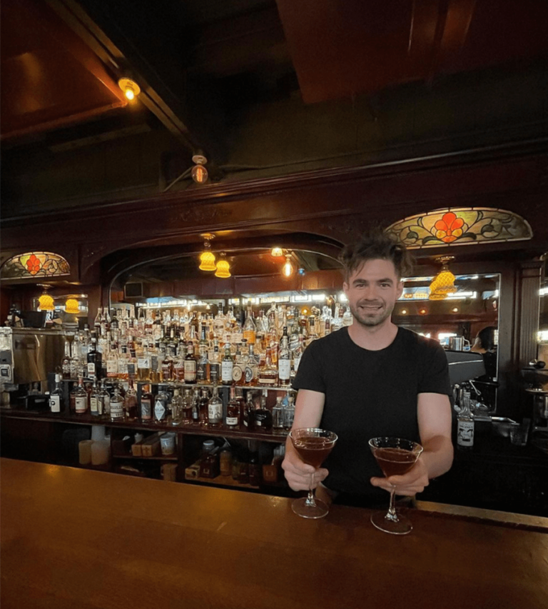 A bartender at McMenamins shows off cocktails