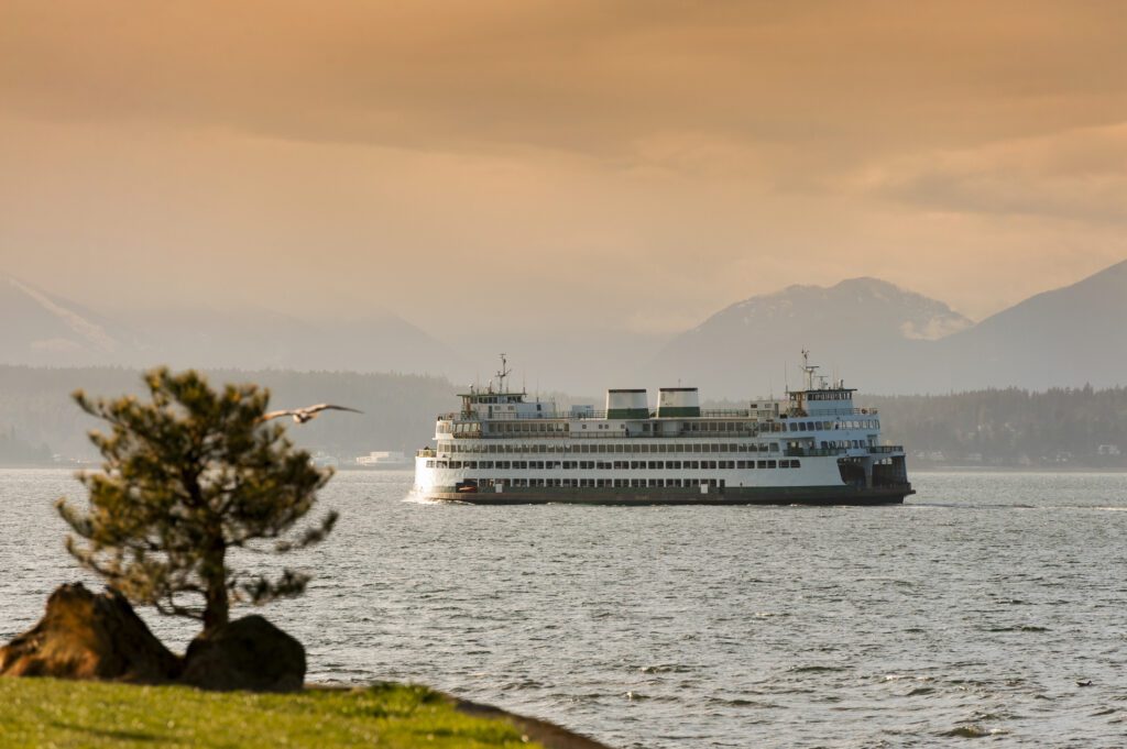 Ferryboats and Mountains. A view from Alki Beach in West Seatte of ferryboats and the Olympic Mountains during a lovely warm springtime sunset.