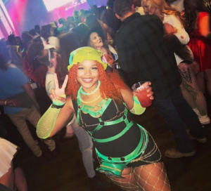 A woman all dressed up in Shrek-themed rave wear at the Shrek Rave
