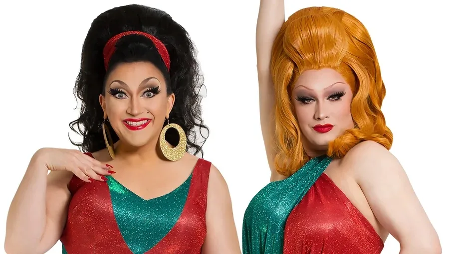 Jinkx and DeLa posing together in Christmasey costumes