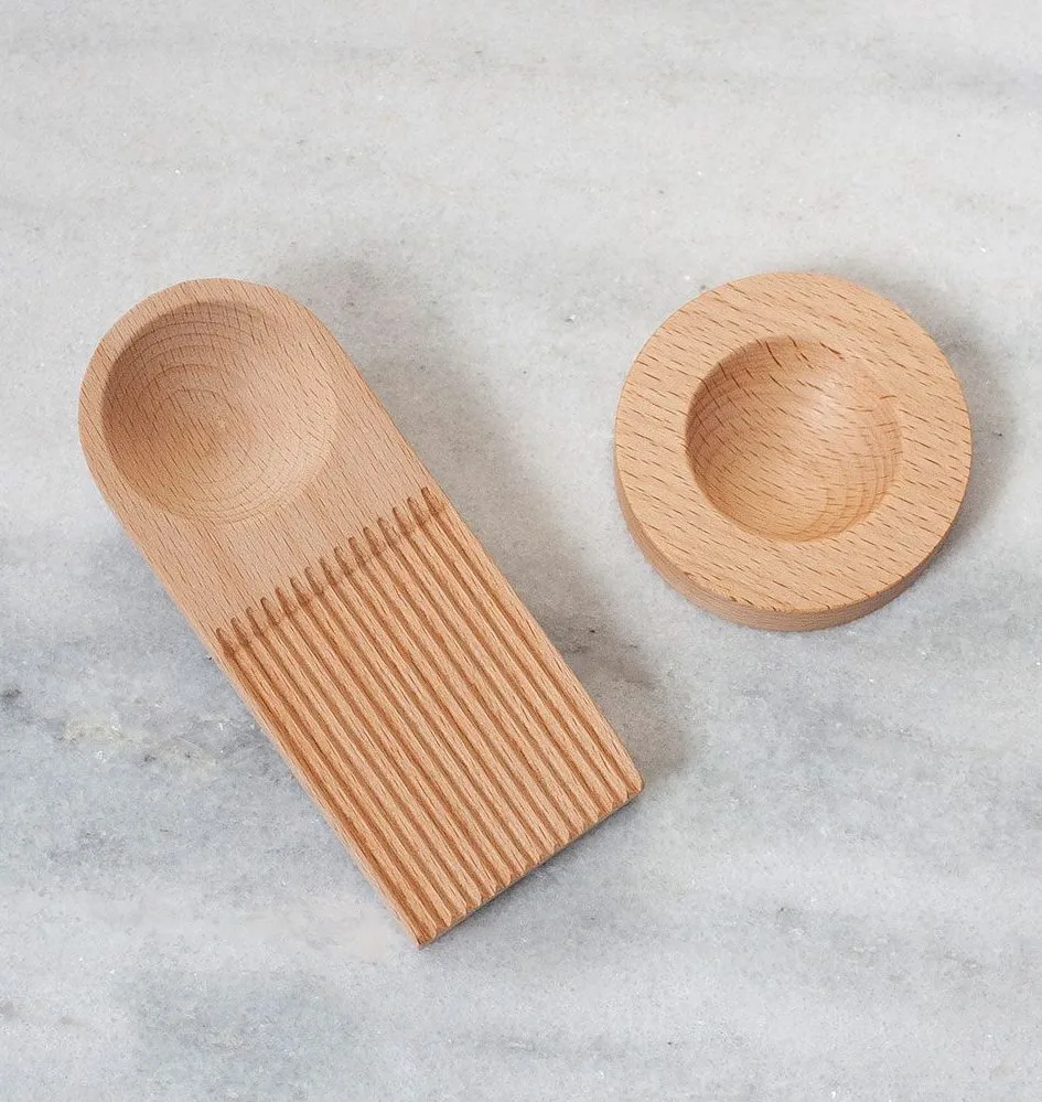 A minimalistic pasta cutting board made out of wood.