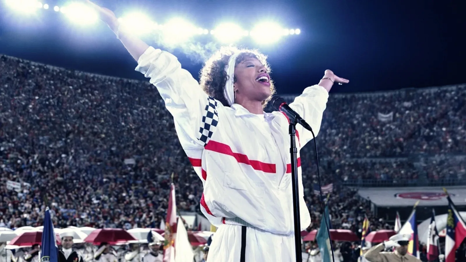 Whitney Houston (played by Naomi Ackie) performs her iconic performace of the National Anthem.
