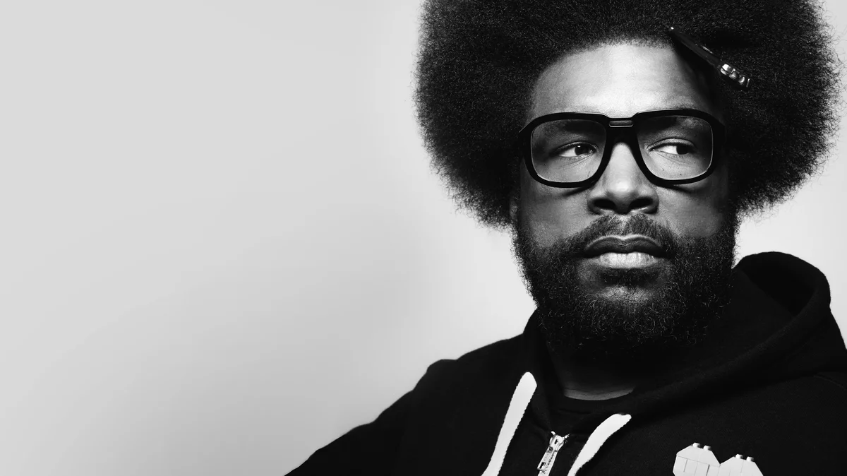 A photo of Questlove looking to the right