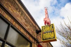 The exterior of Sonic Boom with a light up sign