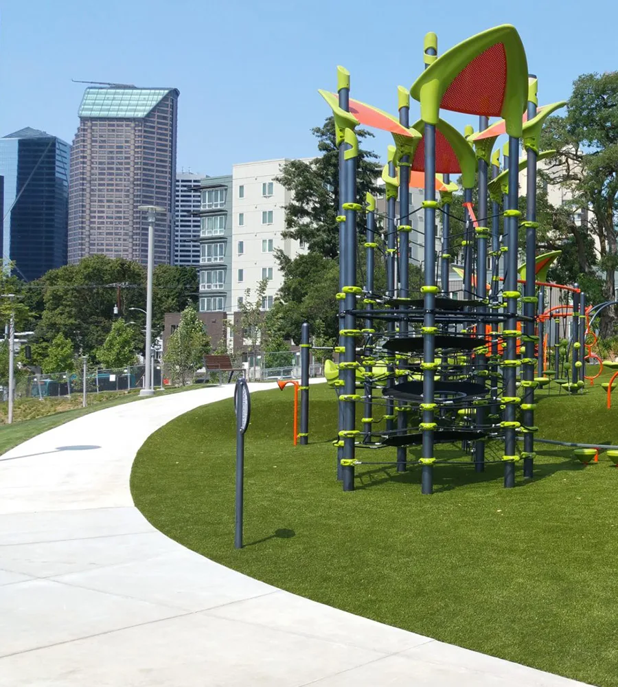 A bright park with lots of lime green toys in central Seattle