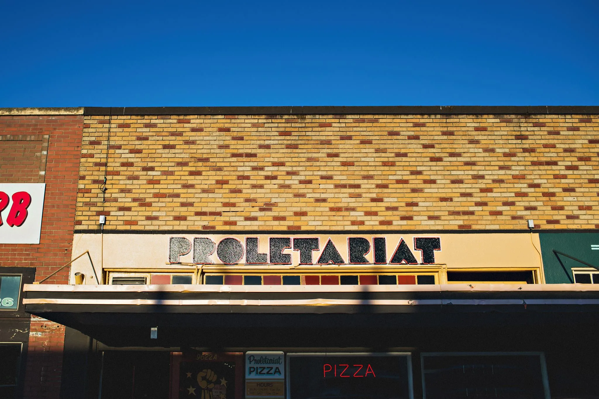 The storefront for Proletariat Pizza in White Center