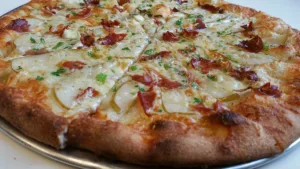 The DTR pizza at Smoking Monkey in Renton featuring sliced pears and proscuitto.