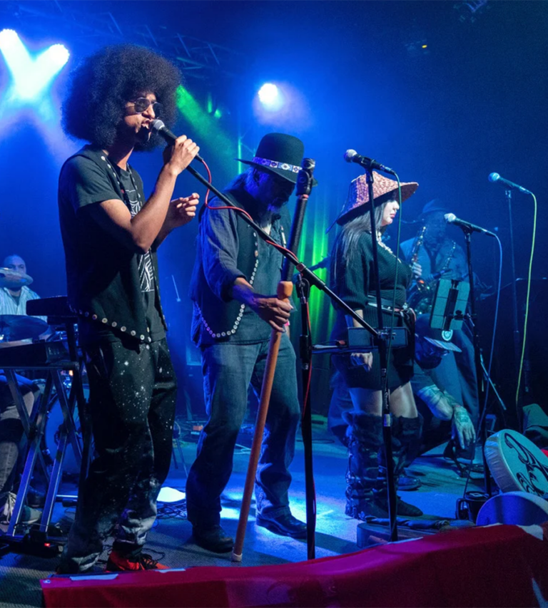 Khu.éex’ The band Khu.éex' performs at the High Dive bathed in blue-green spotlights