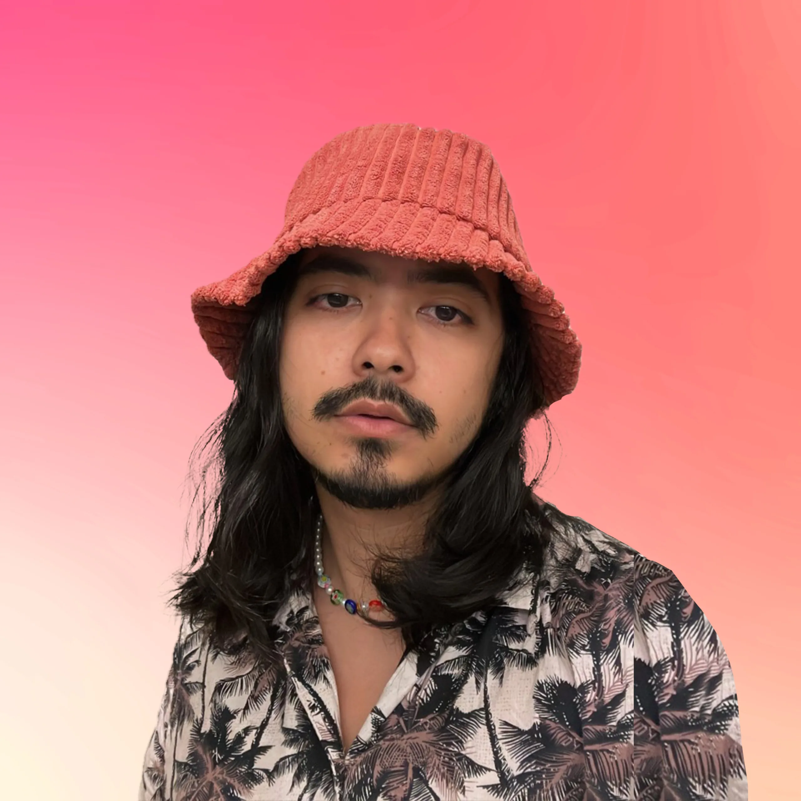 An author pic of Juan Miguel Jocom in a pink bucket hat