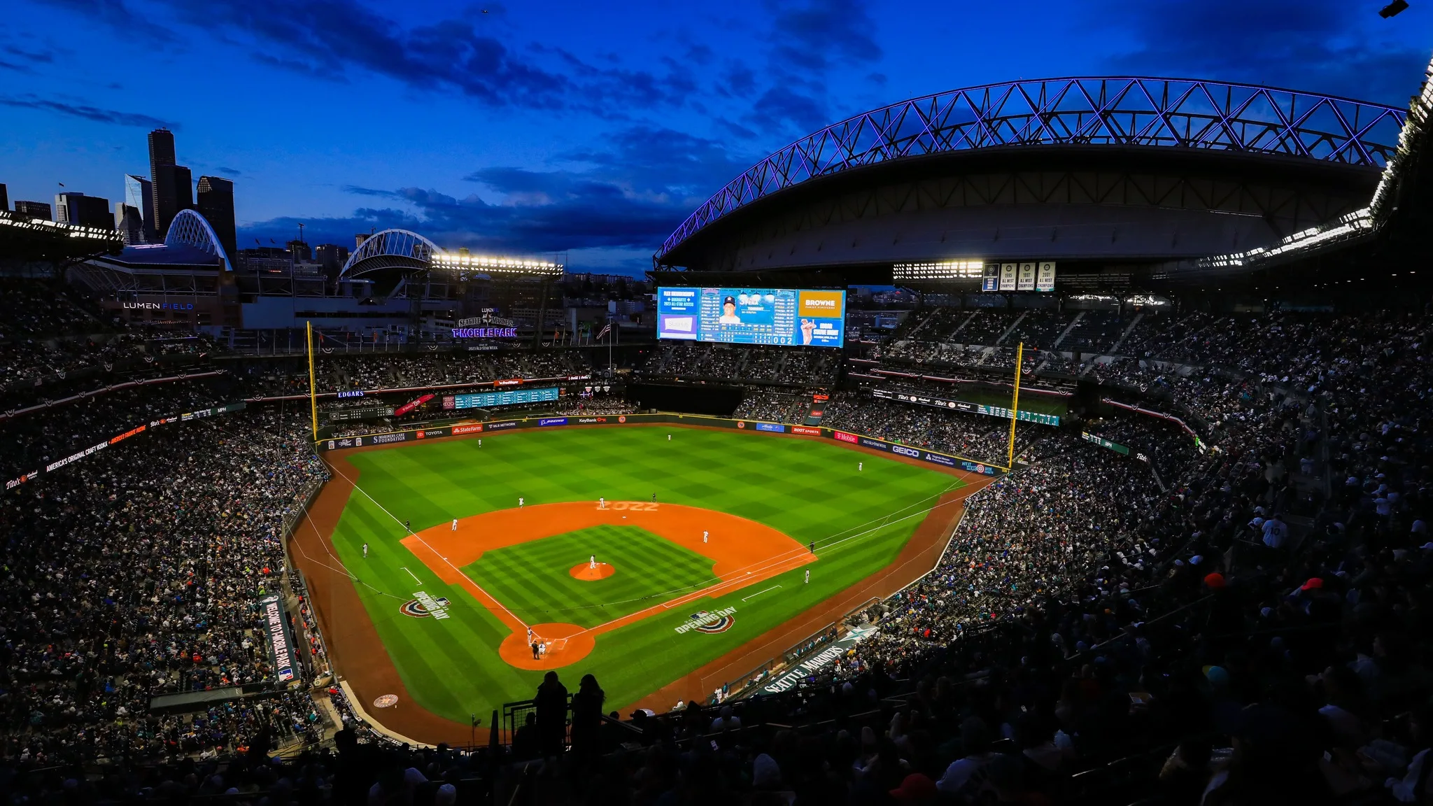 A nighttime view of the baseball field at T-Mobile Park from the stands