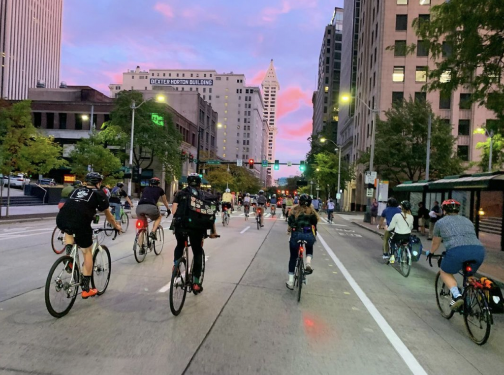 Cyclists move through downtown Seattle in a block