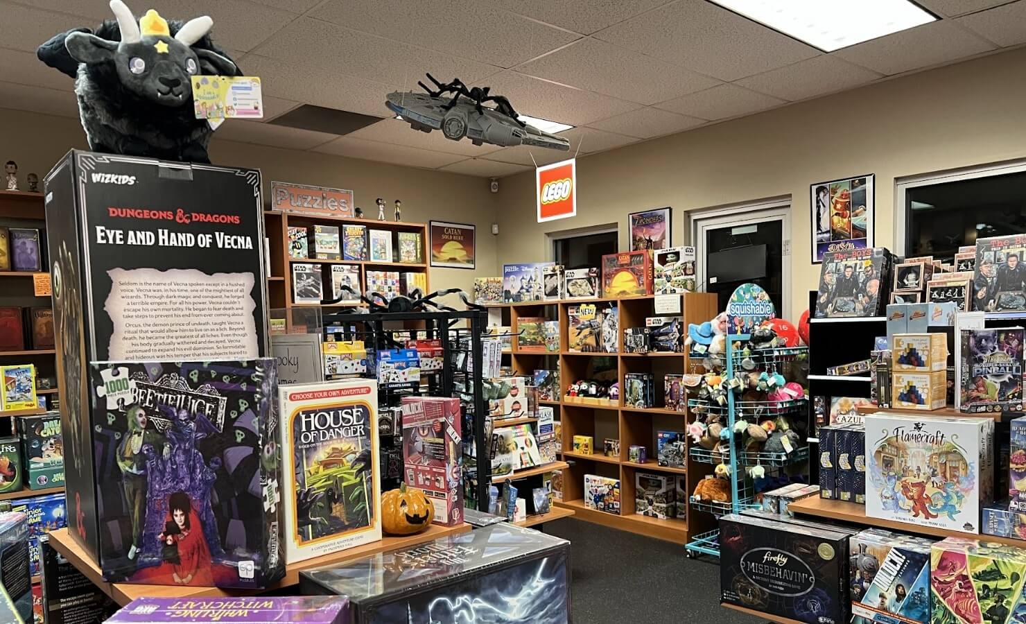A big board game store featuring lots of games.