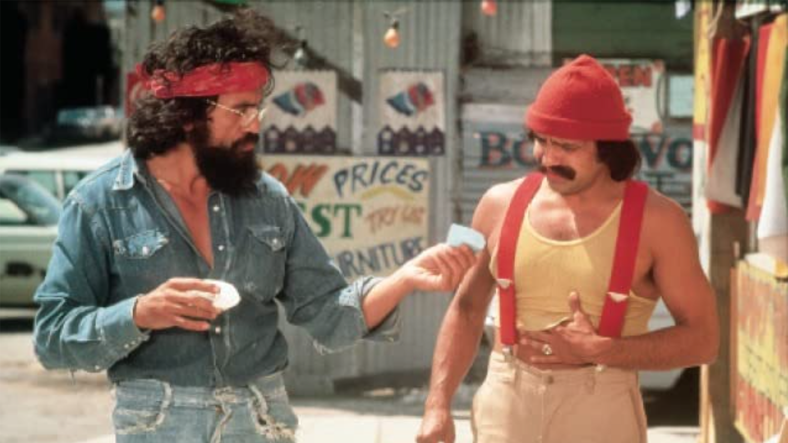 A still from Up in Smoke. Cheech and Chong walk side by side