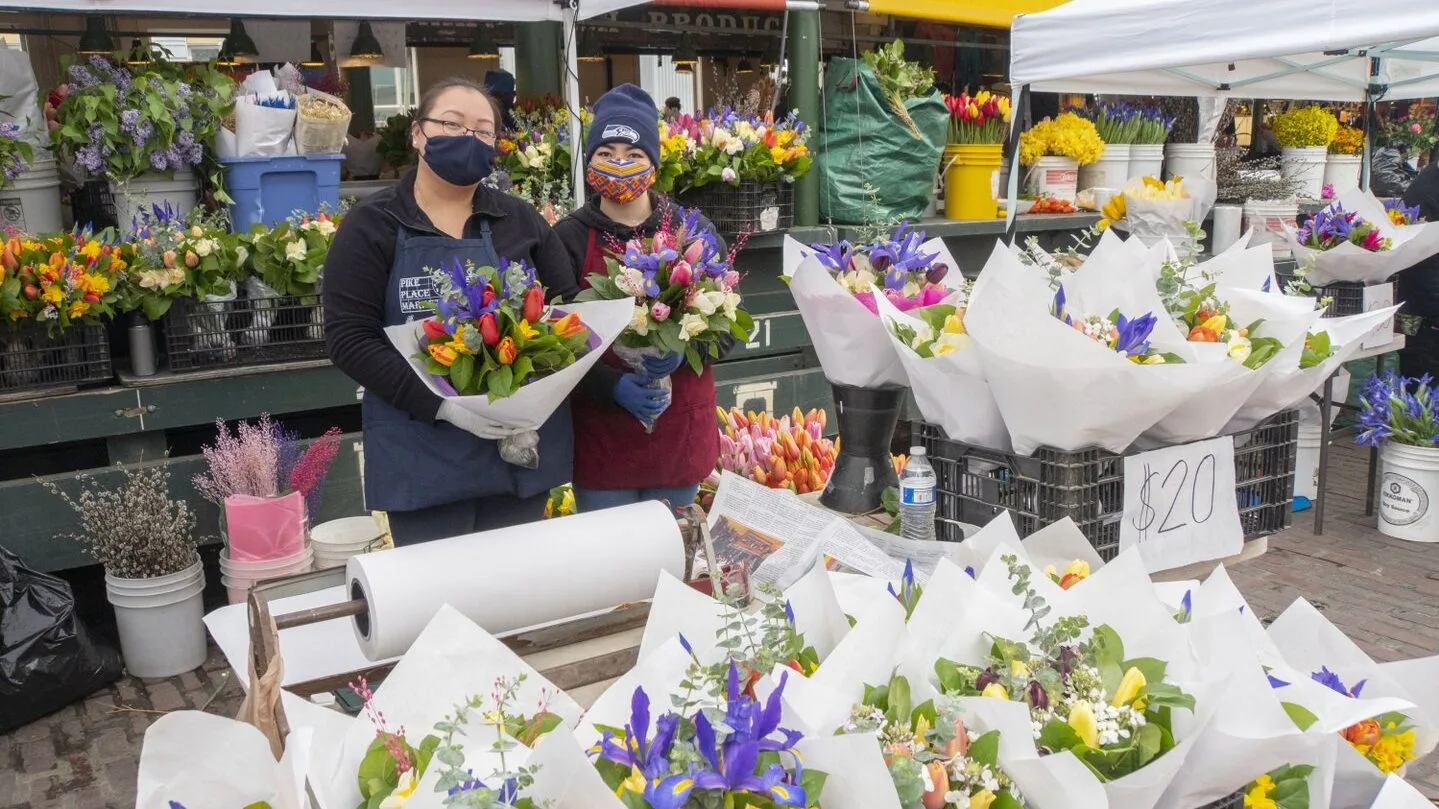 Two vendors at the Pike Place Flower Market