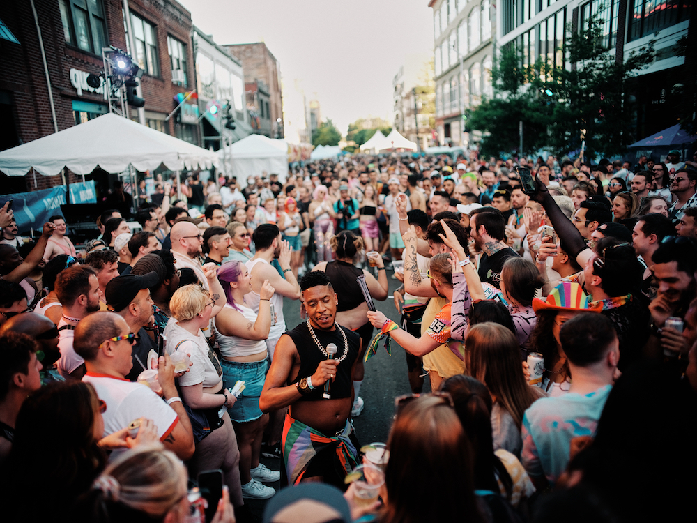 A large party outside of Queer Bar during Queer Pride 2022