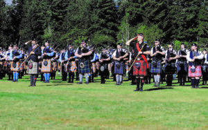 A big group of bagpipe performers playing during the Seattle Scottish Highland Games and Clan Gathering