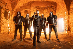 The band Dark Funeral stands in an orange antechamber wearing all black.