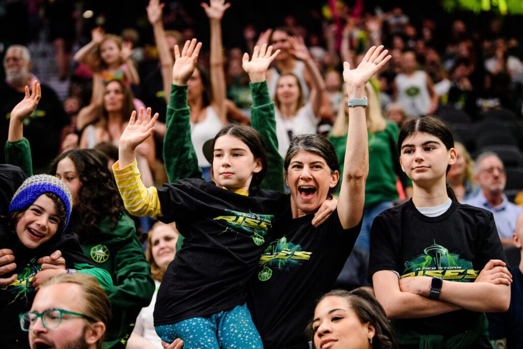 A happy crowd at a Seattle Storm game