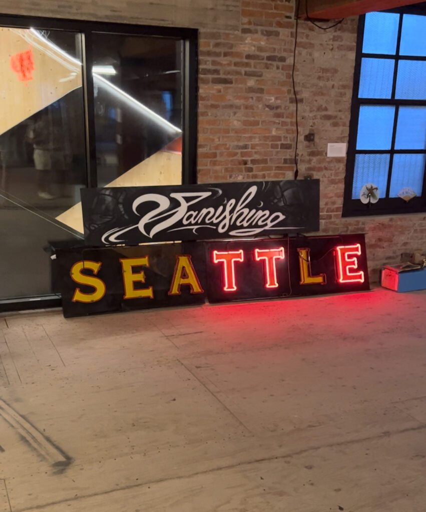 A sign for Vanishing Seattle sits in the RailSpur building