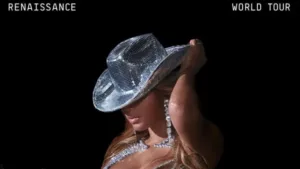 The cover for the Beyonce Renaissance World Tour — featuring Beyonce in a glittery cowboy hat, tilted downard to cover her face.