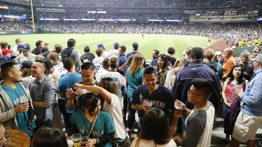 A large group of people drink at T-Mobile Park