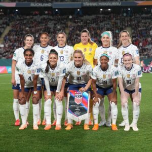 The U.S. Women's National Team pose for a photo after winning a match