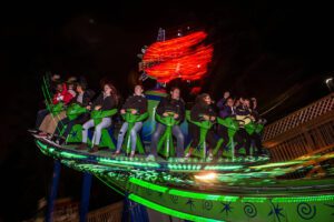 A group of people scream while on a ride at Wild Waves during Fright Fest