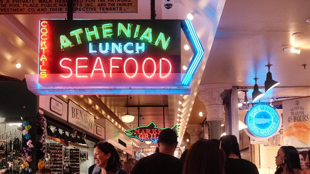 A neon sign for Athenian Seafood in Pike Place Market, featuring in the movie Sleepless in Seattle with Tom Hanks and Meg Ryan.