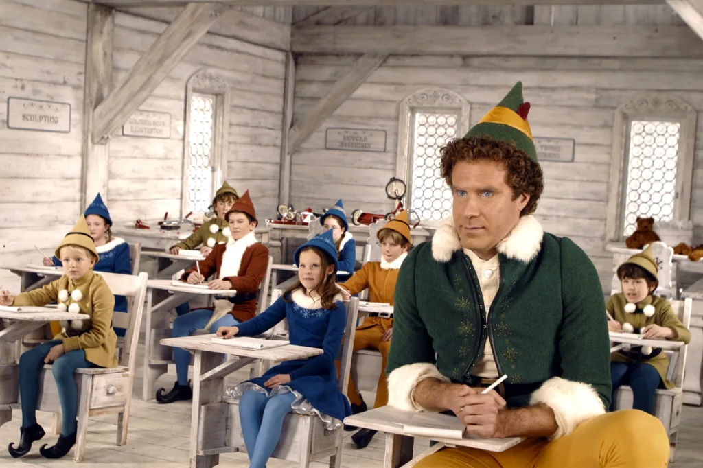 A large elf (Will Ferrel) sits in a class with tinier elfs in the North Pole at Santa's Workshop.