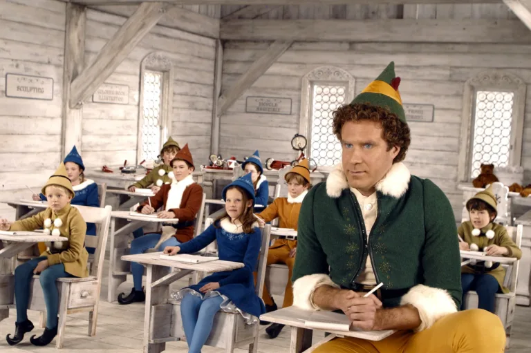 A large elf (Will Ferrel) sits in a class with tinier elfs in the North Pole at Santa's Workshop.