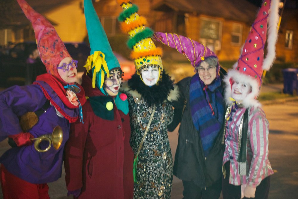 A group of Halloween revelers with tall hats pose for Trolloween.