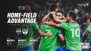 A Sounders promotional poster promoting three games against Dallas, featuring four players hugging each other after a victory.