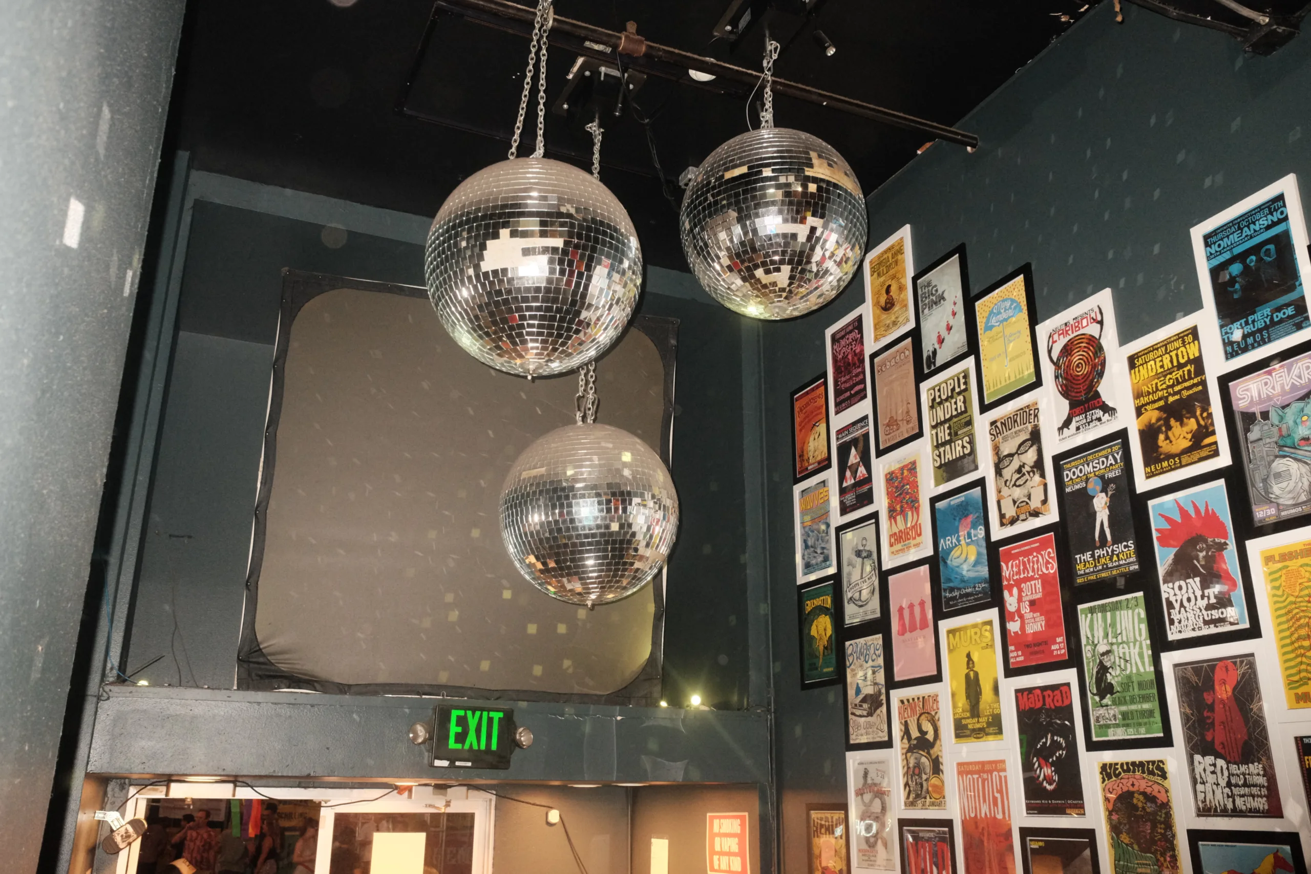 Disco balls hang in the space between Neumos and The Runaway on Capitol Hill in Seattle, Washington. A concert venue.