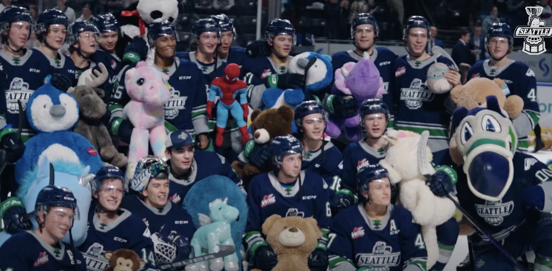 A screenshot of the Seattle Thunderbirds posing with teddy bears after winning