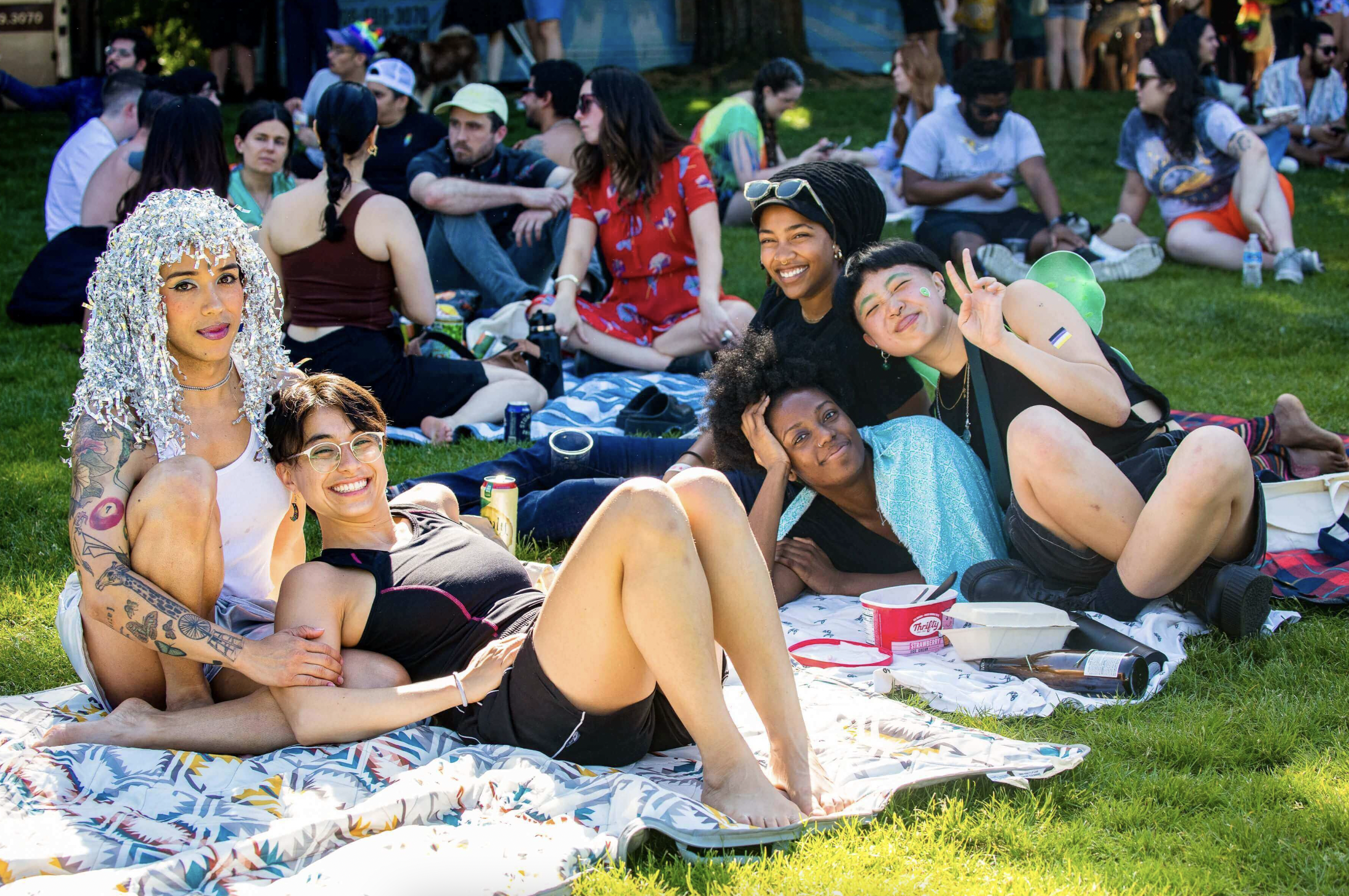 A group of friends lounging during a Pride event in Seattle.