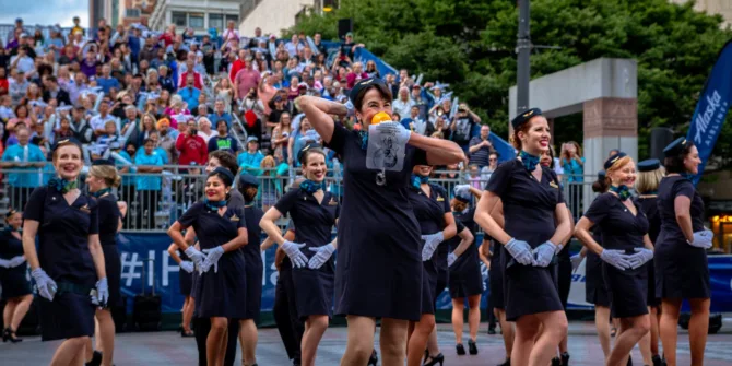 Alaska Airlines drill team of flight attendants perform during the annual Torchlight Parade at the Seafair Festival in Seattle, Washington.