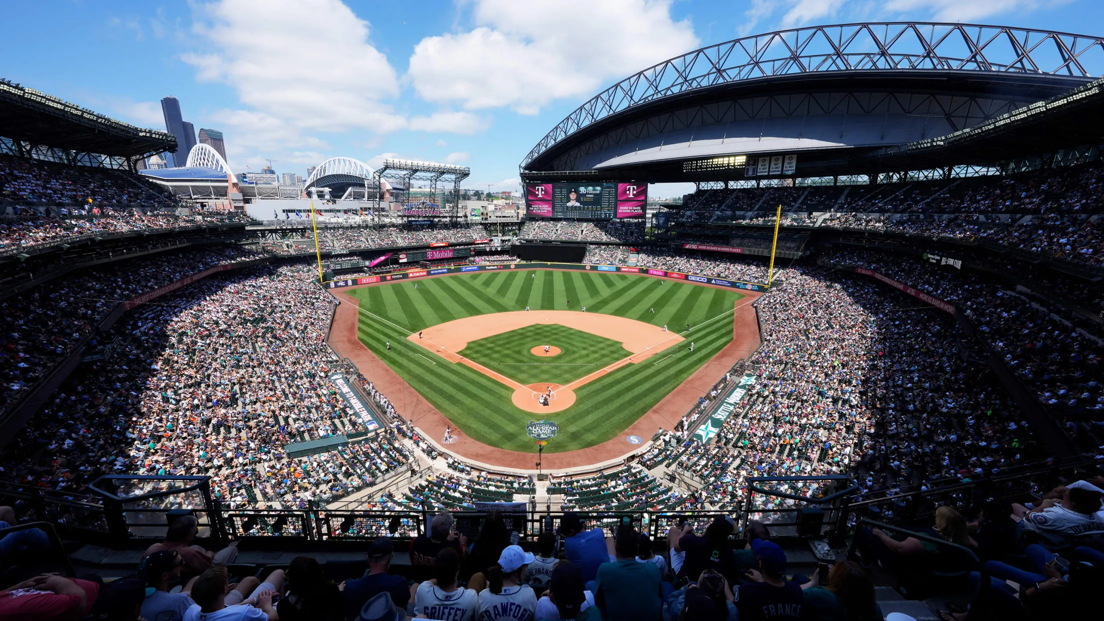 A view of a full T-Mobile Park during a warm Mariners game day in Seattle, Washington.