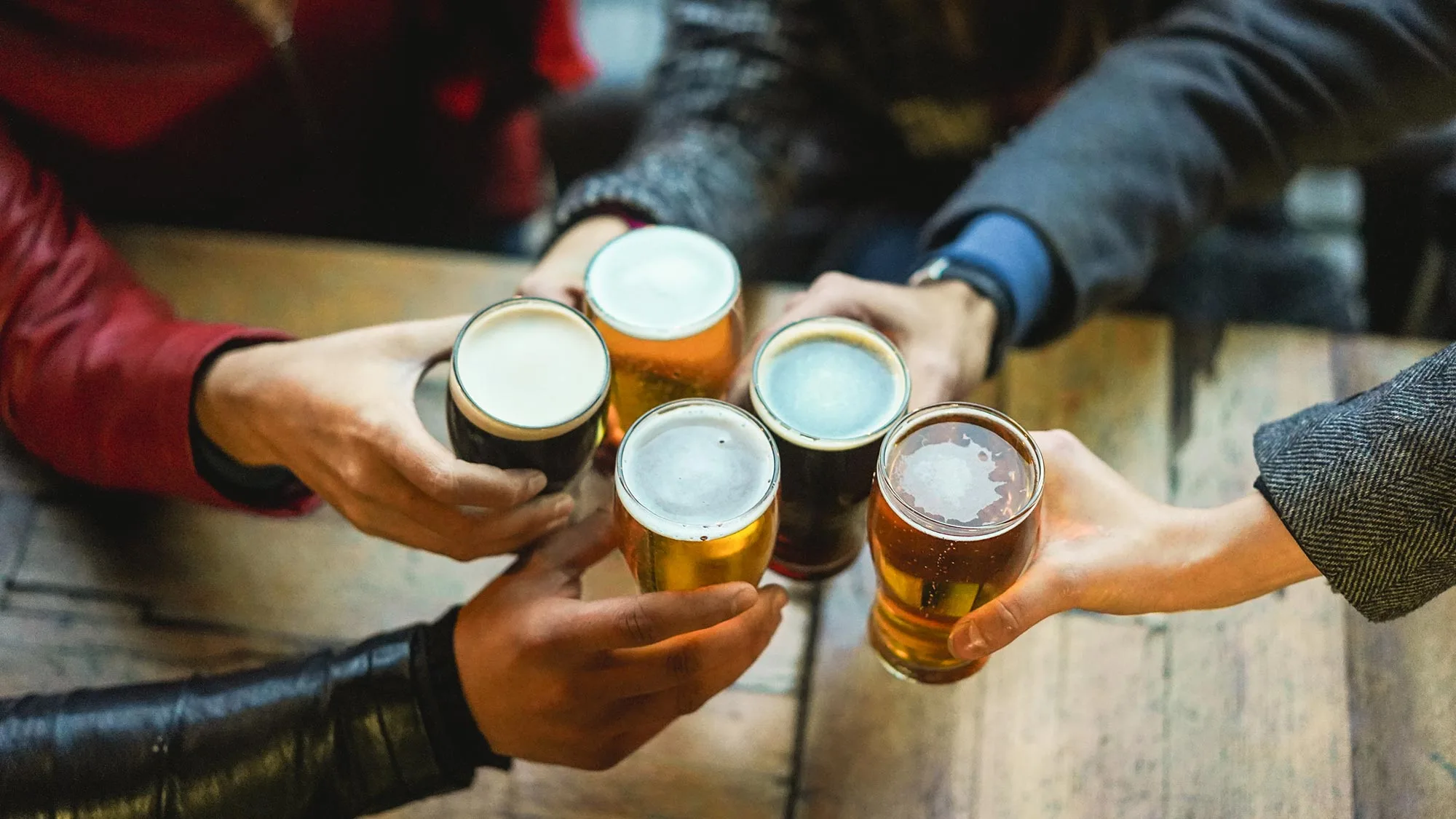 Friends toasting with beer