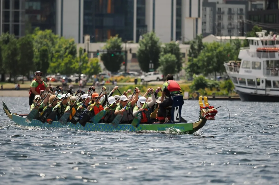 Team of dragon boat racers on Lake Union