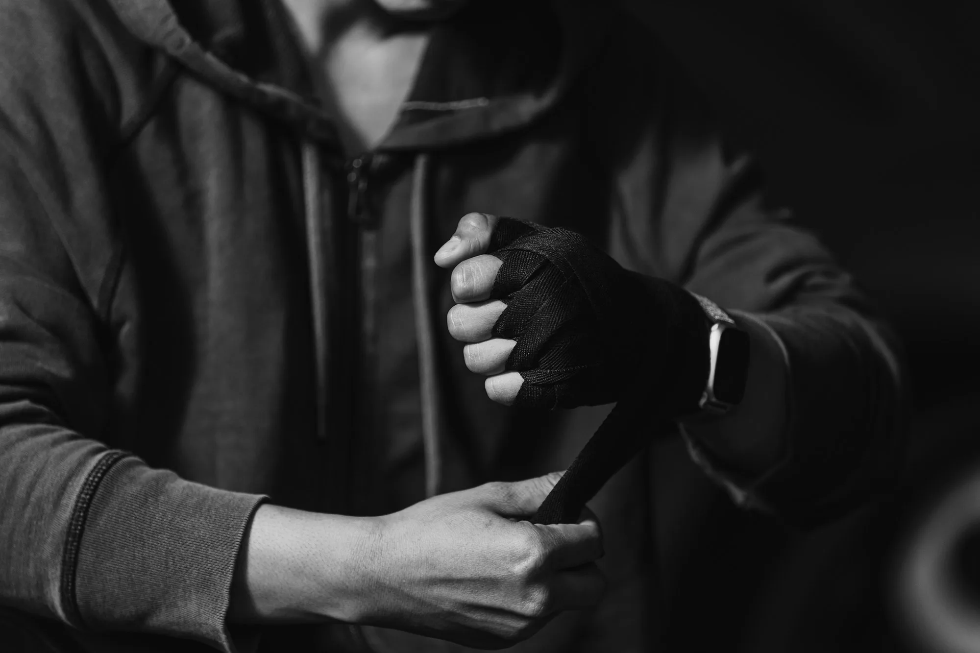 Martial arts fighter putting on gloves