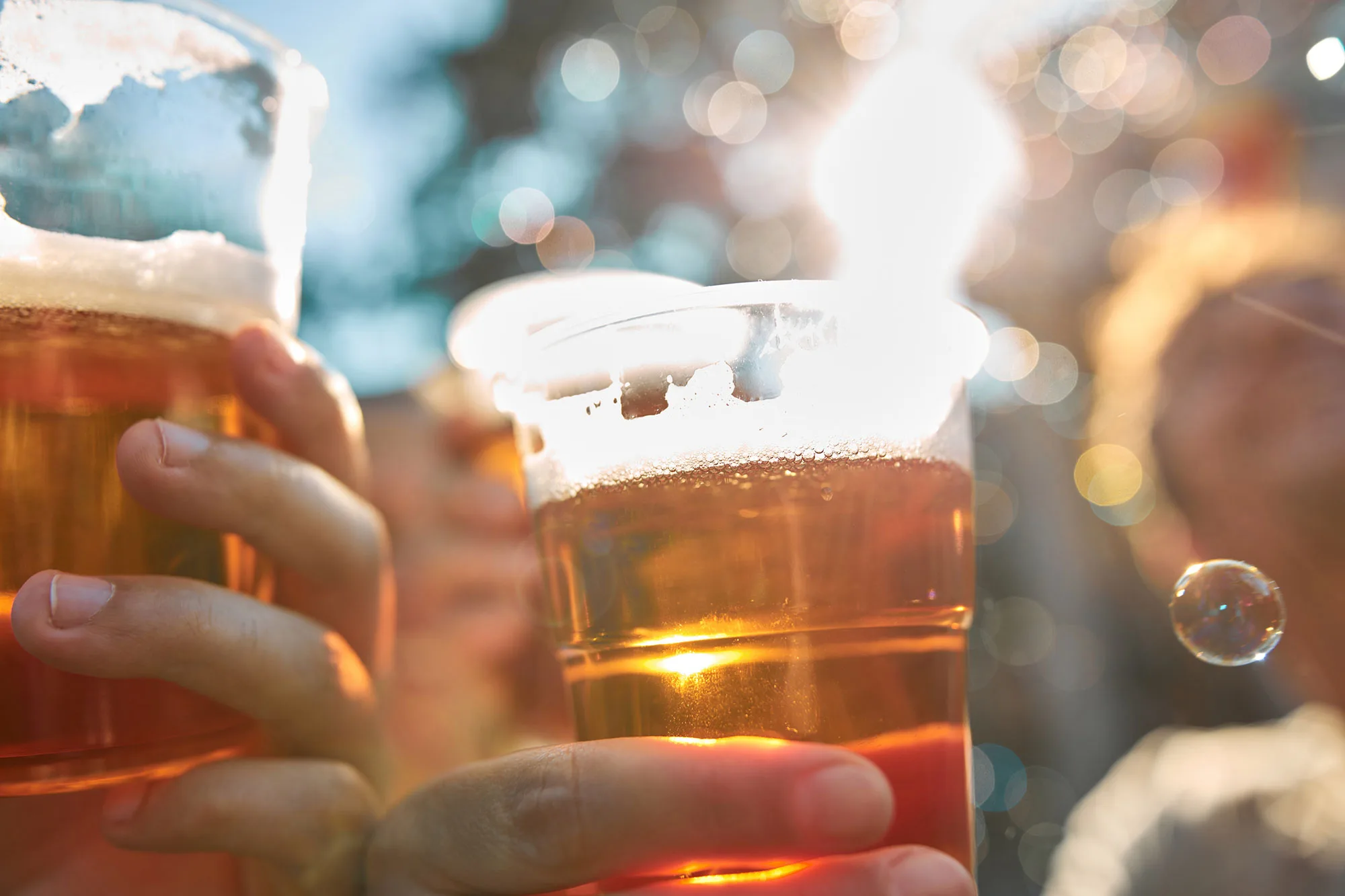 People clinking beer glasses