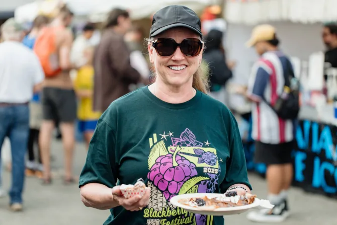 A woman enjoying the 2025 Bremerton Blackberry Festival
