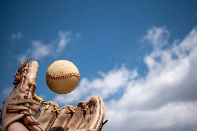 Baseball glove catching a ball