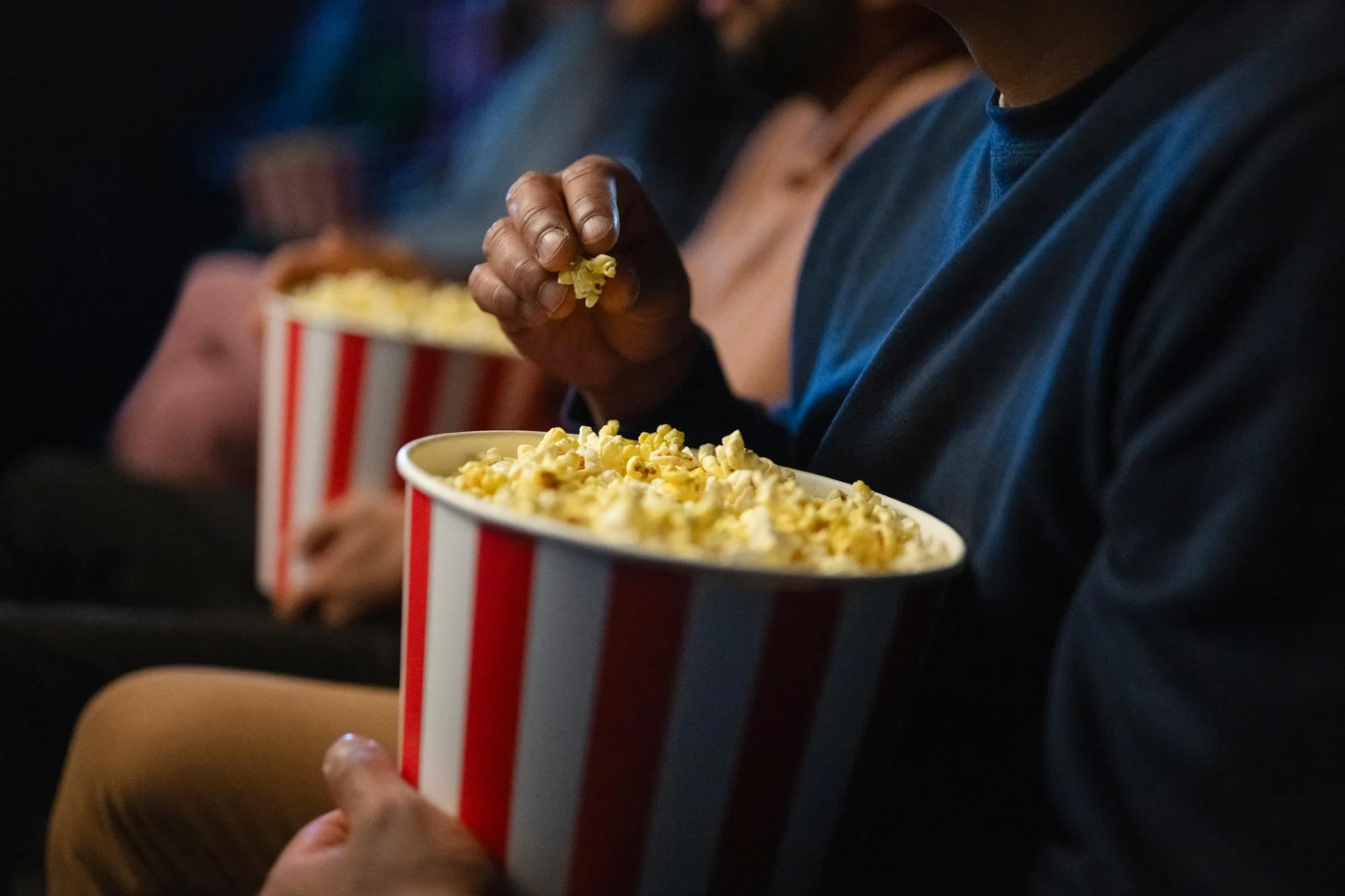 Moviegoers eating popcorn