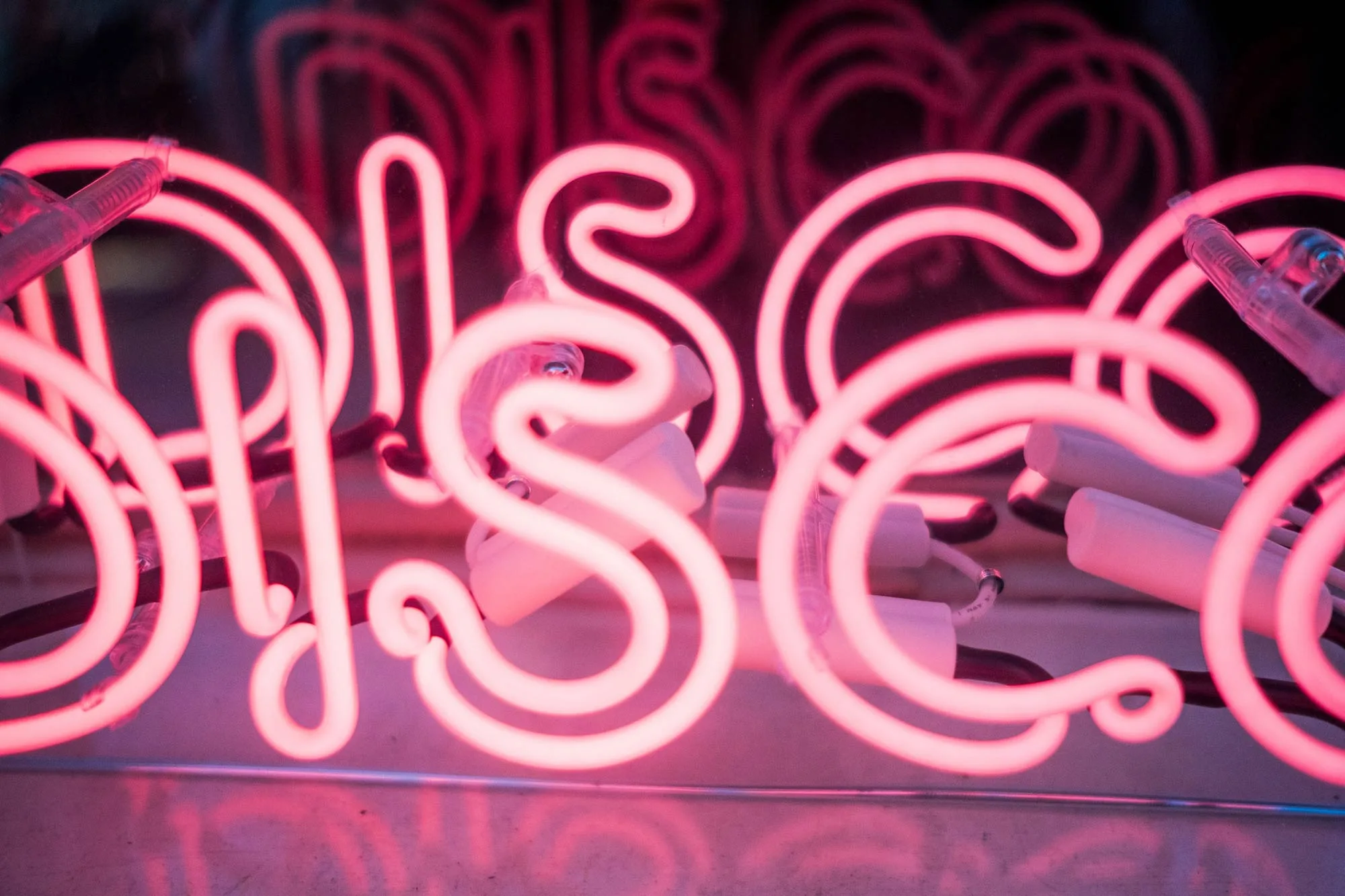 Pink neon disco sign